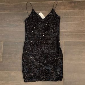 Black fitted (knee lengthish) sequin dress